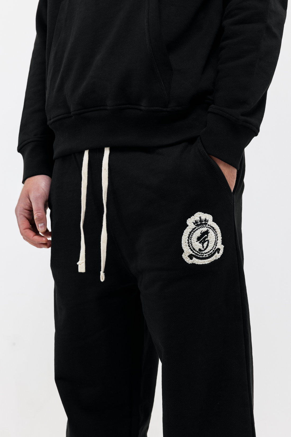 Benjart Chenille Badge Joggers in black, badge detail